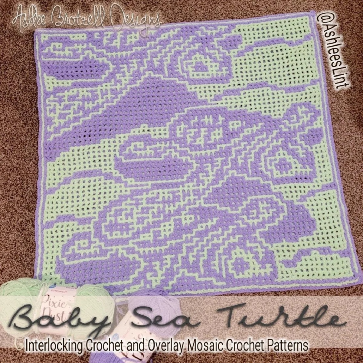 Green crochet blanket with purple sea turtles stitched on the top lying on a brown carpet.