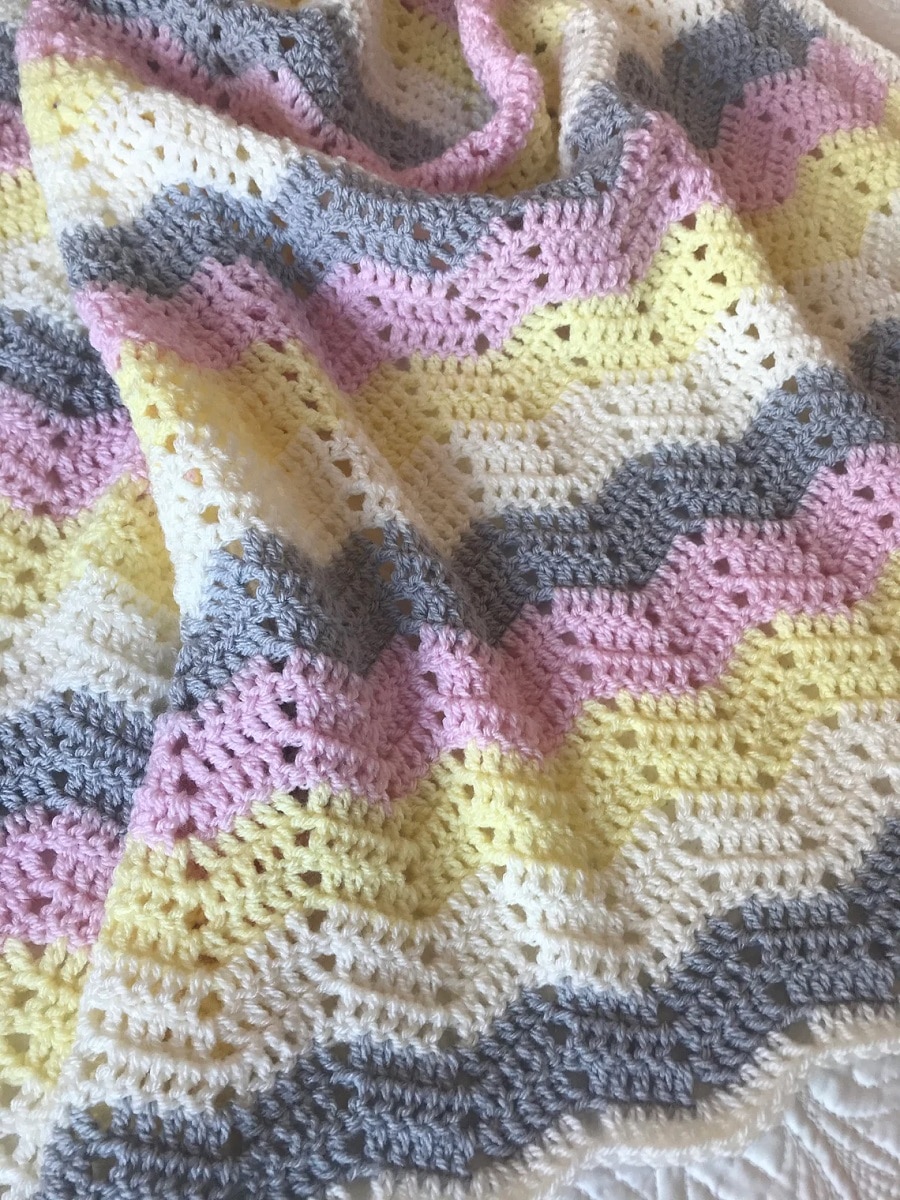 Purple, cream, gray, and yellow chevron zig-zag crochet blanket. 