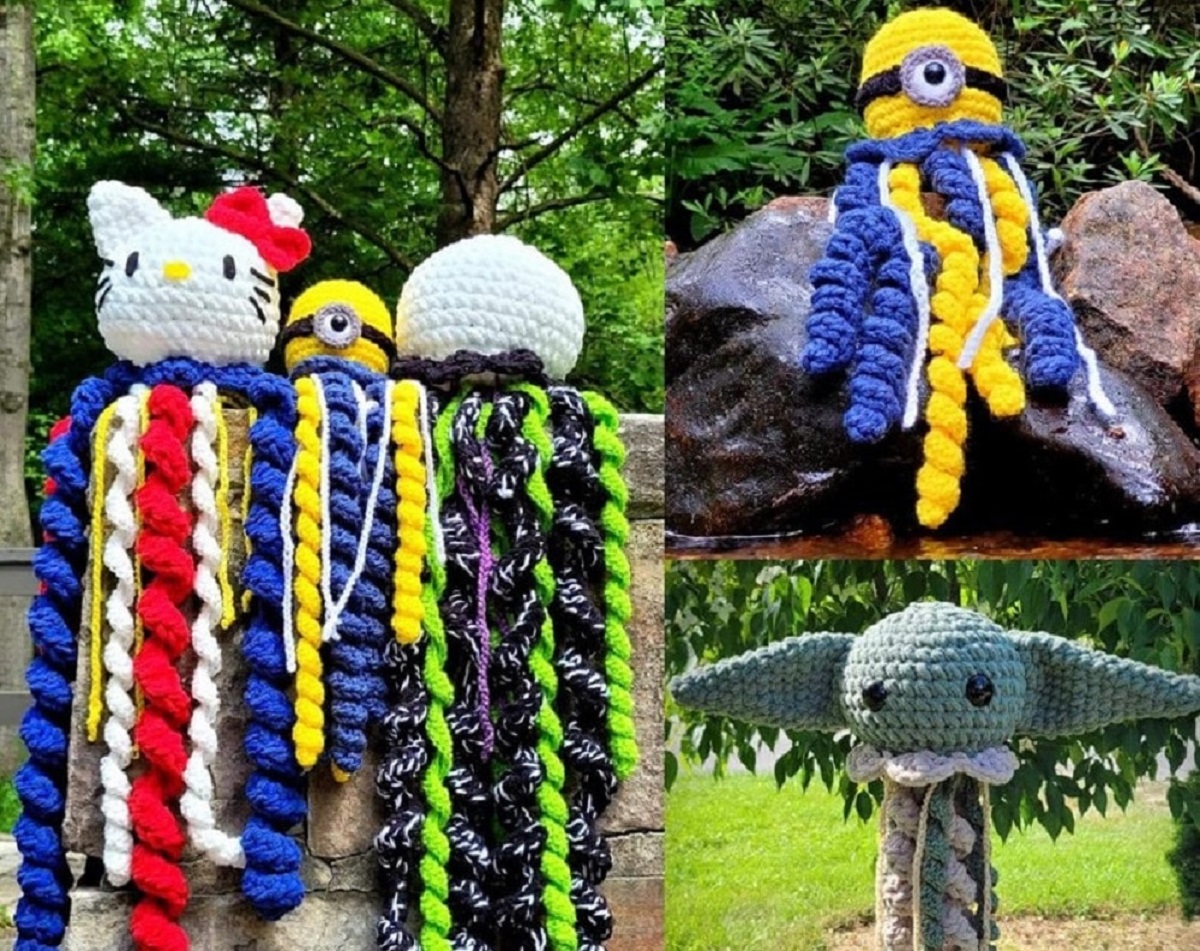 Large crochet jellyfish with Hello Kitty, baby Yoda, and Minion heads standing outside in front of trees.