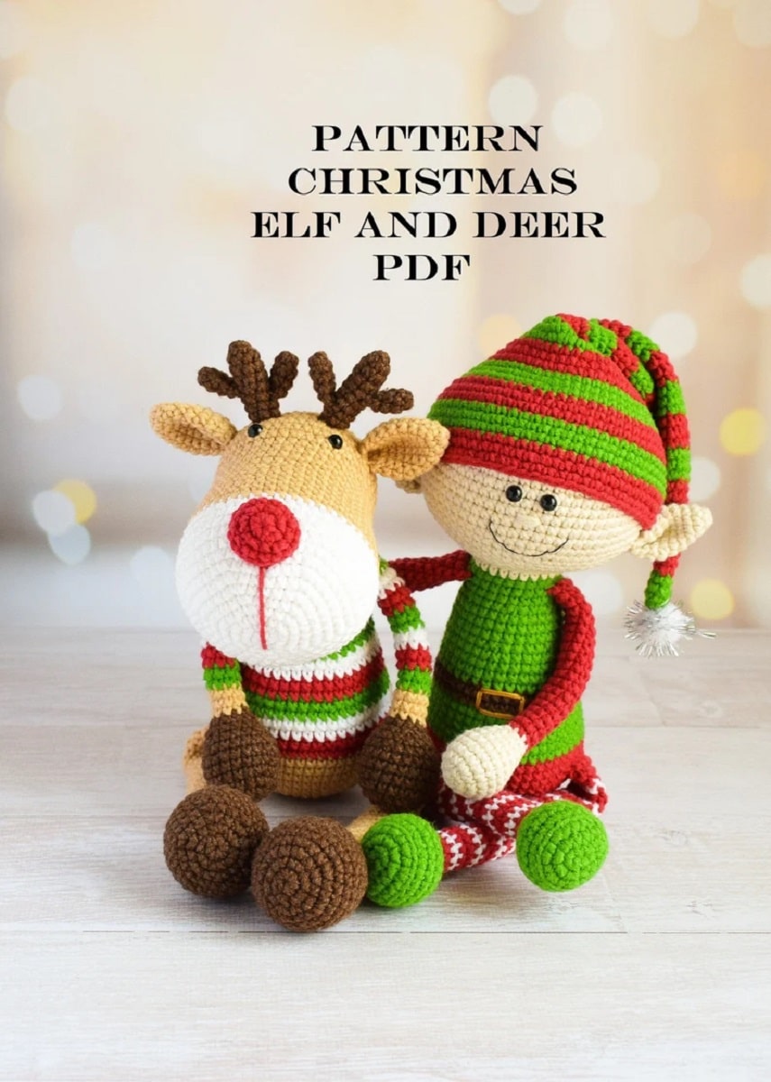 A crochet elf in a red and green striped hat and red and green outfit next to a reindeer in a striped jumper.