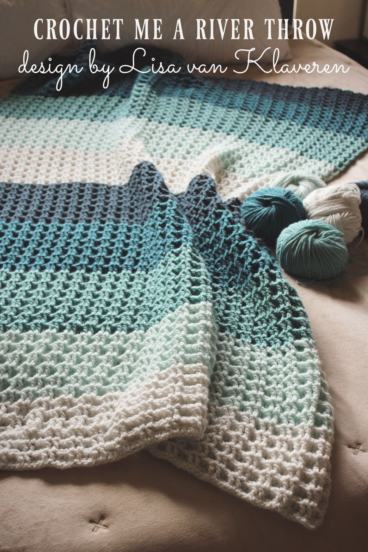  A cream, light blue, blue, and navy blue horizontal striped crochet blanket spread over a sofa next to some yarn balls.