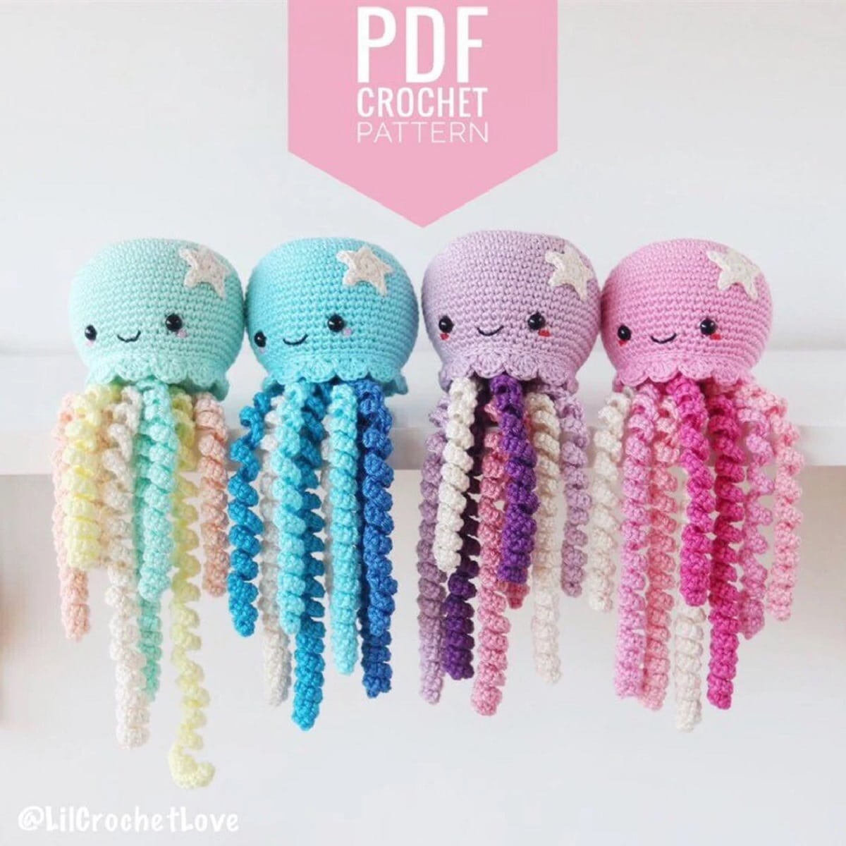 Four small crochet octopus sitting on a shelf together with ruffle style tentacles dangling down. Octopus are green, blue, purple, and pink.