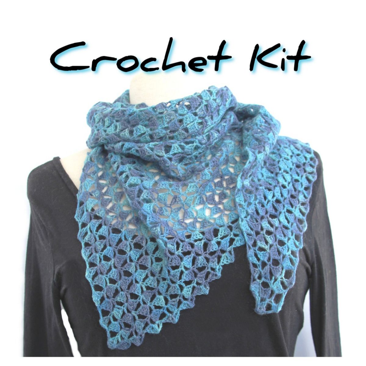 Blue lace style crochet scarf wrapped around a mannequin's neck with a black top on. 