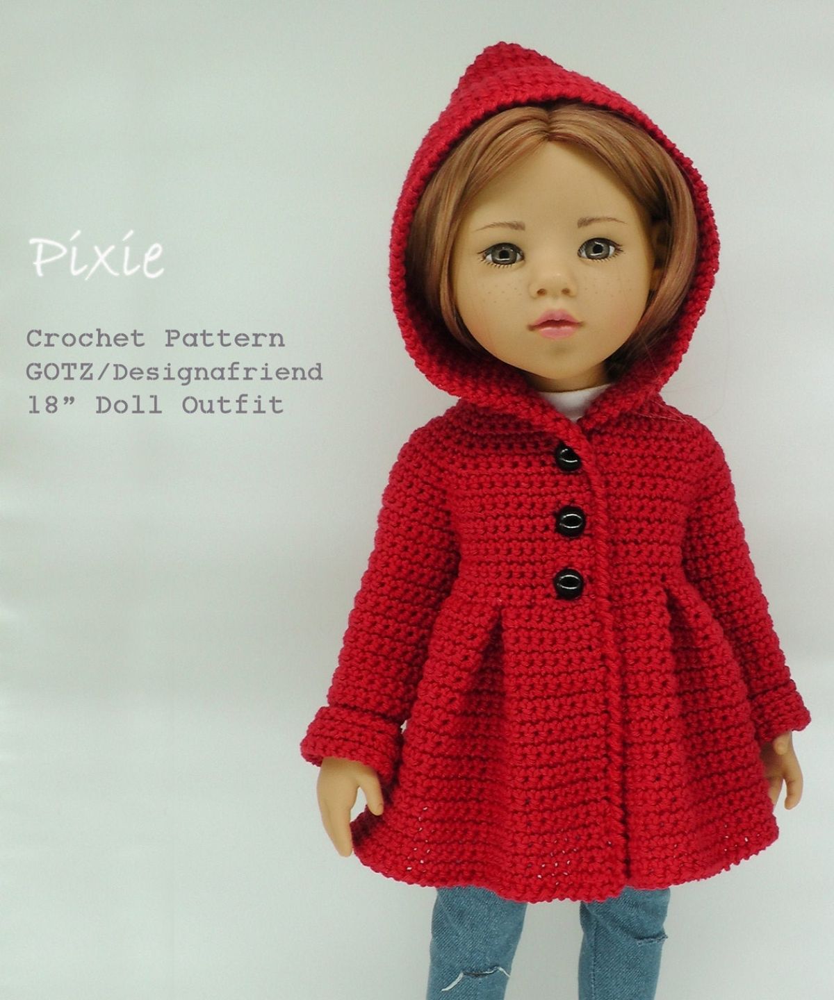 Blond doll wearing a buttoned up red crochet hooded coat with blue jeans underneath on a white background.