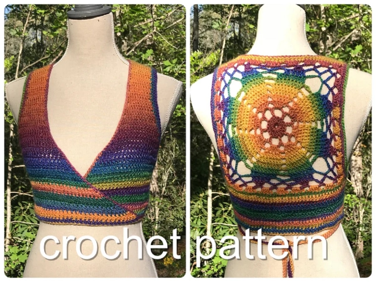 A mannequin wearing a v-neck cropped multicolored vest with a yellow, blue, and green flower shaped mandala on the back.