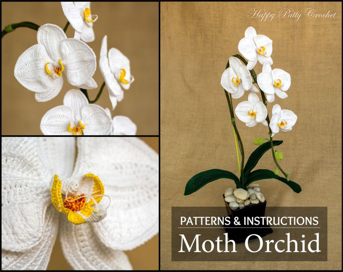 A white crochet orchid with yellow centers on all the flowers next to some dark green leaves and a small plant pot filled with pebbles.