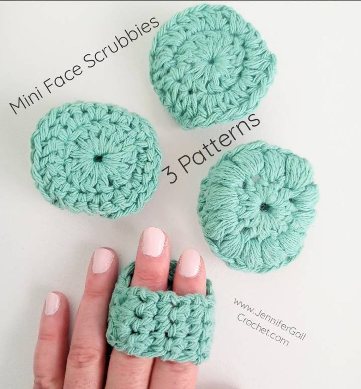 Three round mini crochet face scrubbies next to a manicured hand with the back of a scrubbie stretched over two fingers.