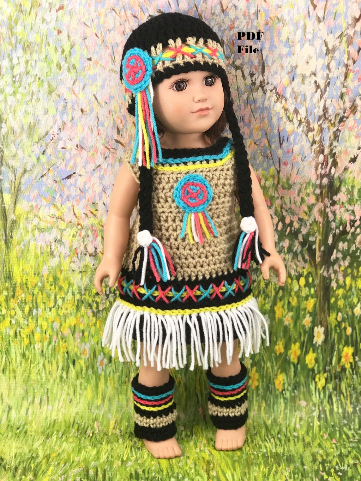 Brunette doll wearing a traditional native crochet dress with white tassels on the bottom with a matching hat and leg warmers.