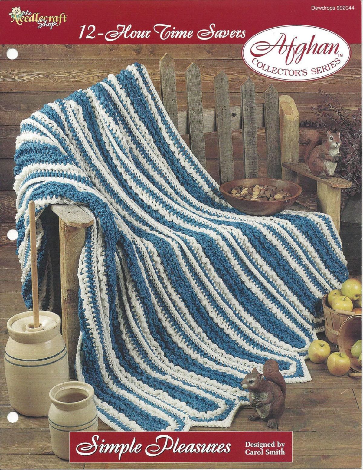 Blue and white vertical striped afghan with rounded edges draped over a wooden chair surrounded by squirrels and butter churners. 