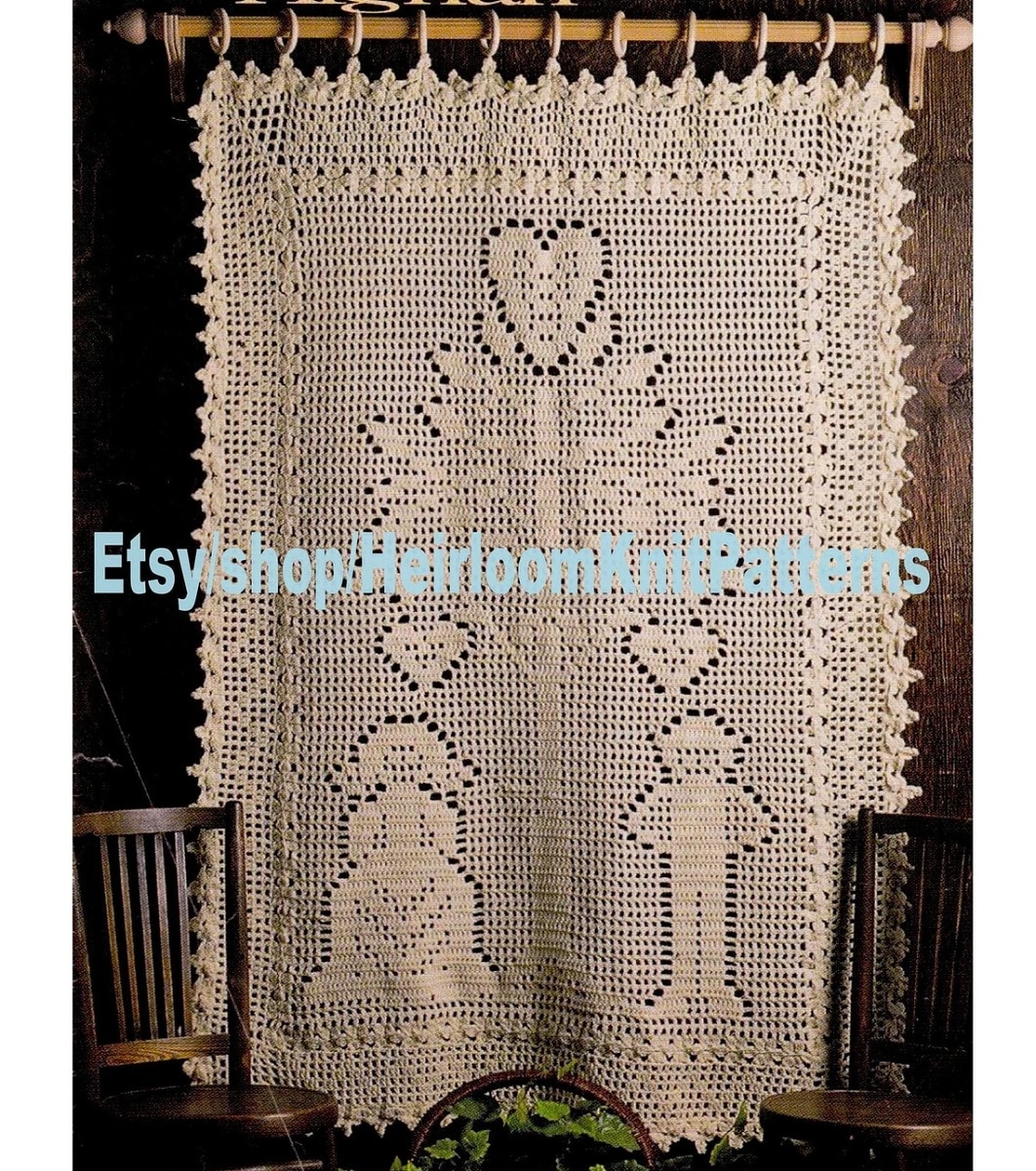 Large cream crochet afghan with a bride and groom standing underneath a tree with a heart on top.