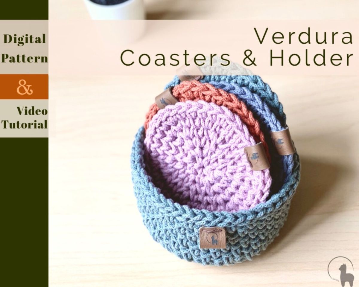 Lilac, orange, and blue crochet coasters stacked in a crochet blue coaster holder on a wooden table.