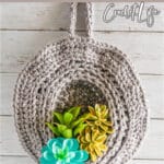 free pattern crochet hanging basket with text which reads easy hanging basket free crochet pattern