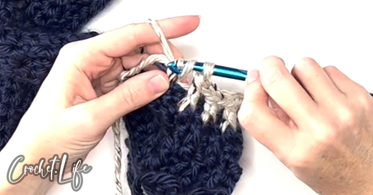 easy alpine stitch demonstration as part of a crochet pattern to make a Scarf with Sleeves